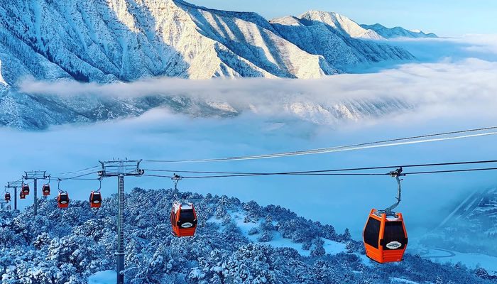 Adventure Park – Winter Embrace the winter enchantment with this captivating image of the Adventure Park Gondola. Against a backdrop of snow-covered mountains and ethereal clouds, the vibrant orange gondola cars stand out in the foreground, ready to transport adventurers to a world of snowy thrills. Experience the magic of winter vistas and outdoor excitement with the iconic gondola as your gateway to the mountain wonderland.