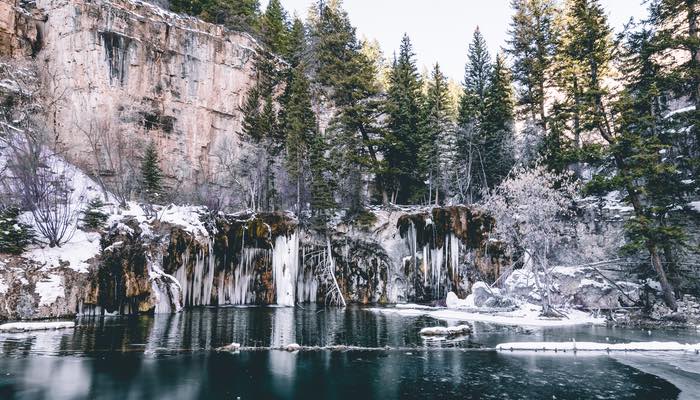 HANGING LAKE WINTER In this photograph, the tranquil allure of Hanging Lake in Glenwood Springs, Colorado is frozen in winter's embrace.