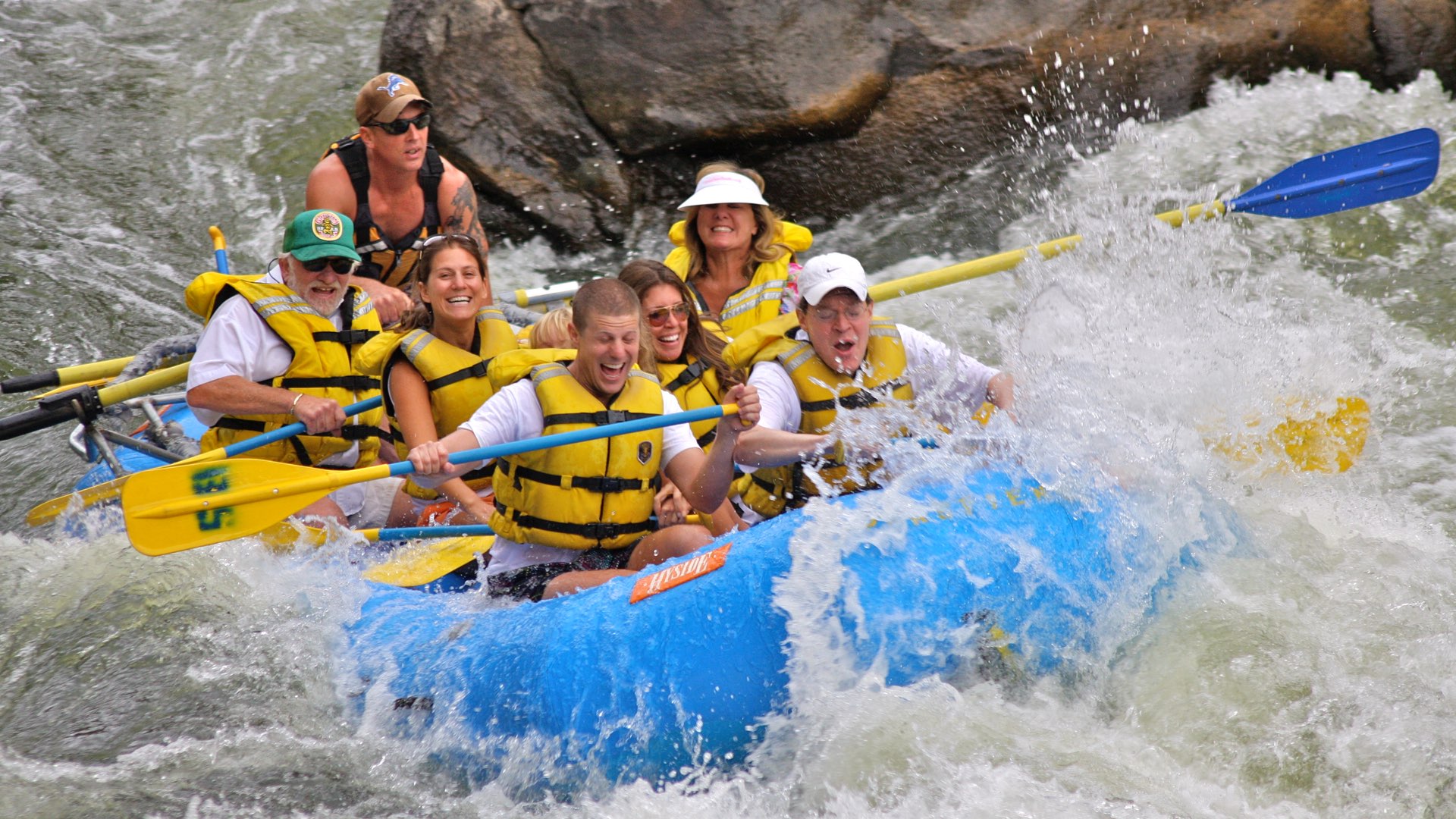 This captivating image showcases the excitement of a raft navigating through the exhilarating Shoshone Rapids.